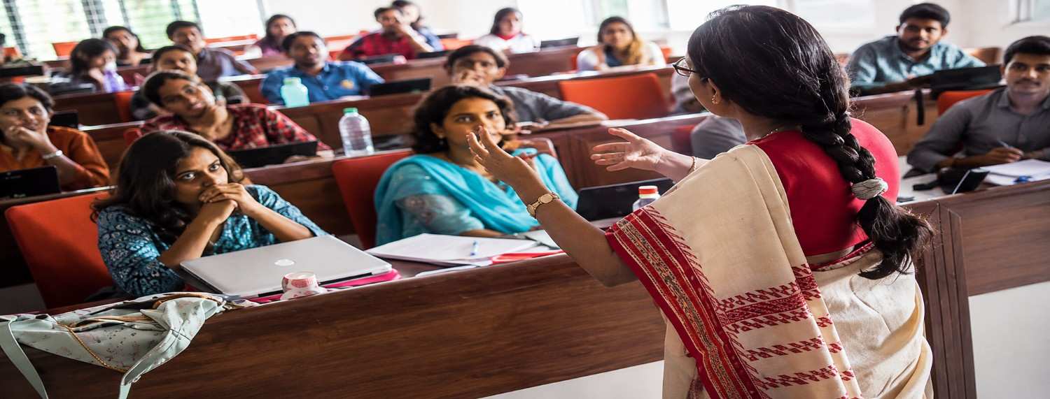 Women students attending a higher education classroom session supported by Indbharat Global Foundation